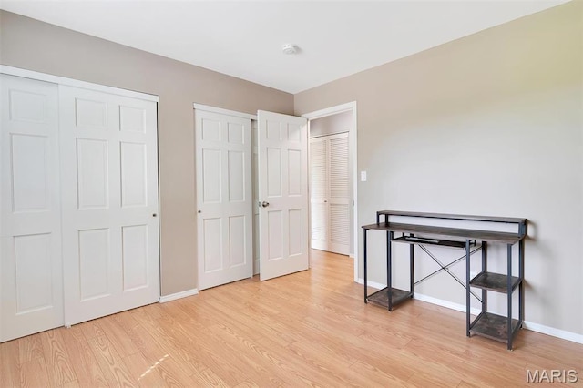 1316 Holgate Dr Unit G5, Ballwin, MO 63021 - bedroom with light wood-style flooring and baseboards