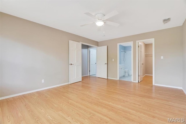 1316 Holgate Dr Unit G5, Ballwin, MO 63021 - unfurnished bedroom featuring baseboards, light wood finished floors, a spacious closet, and ensuite bathroom