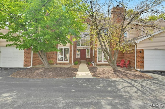 1316 Holgate Dr Unit G5, Ballwin, MO 63021 - view of front of house with brick siding and a chimney