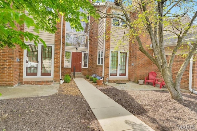 1316 Holgate Dr Unit G5, Ballwin, MO 63021 - doorway to property with a patio area and brick siding