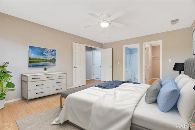 1316 Holgate Dr Unit G5, Ballwin, MO 63021 - bedroom featuring light wood-type flooring, baseboards, ensuite bathroom, ceiling fan, and a spacious closet