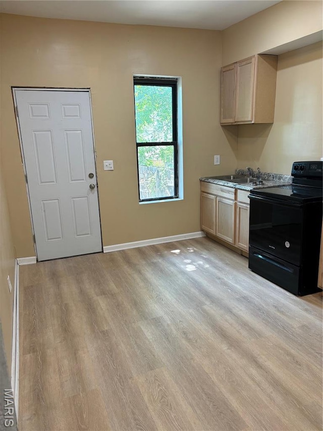 4844 Northland Ave, Saint Louis, MO 63113 - kitchen featuring black range with electric stovetop, light wood-type flooring, baseboards, and light brown cabinets