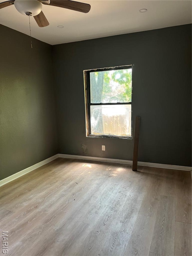 4844 Northland Ave, Saint Louis, MO 63113 - spare room featuring ceiling fan, wood finished floors, and baseboards