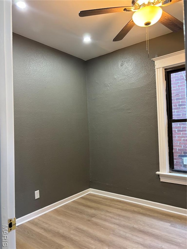 4844 Northland Ave, Saint Louis, MO 63113 - empty room with wood finished floors, a ceiling fan, baseboards, recessed lighting, and a textured wall