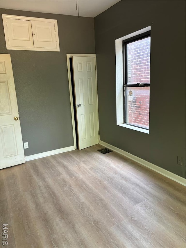 4844 Northland Ave, Saint Louis, MO 63113 - unfurnished room with wood finished floors and baseboards