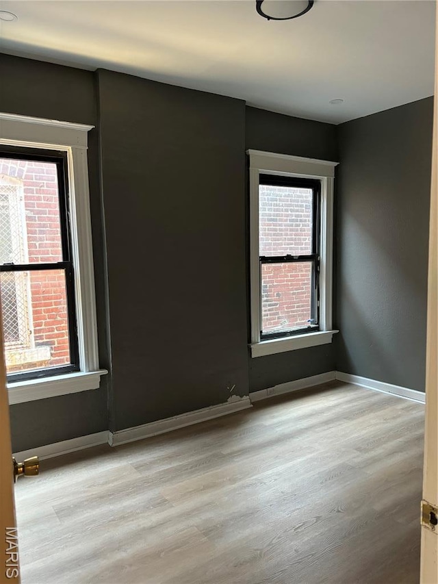 4844 Northland Ave, Saint Louis, MO 63113 - unfurnished room with wood finished floors and baseboards