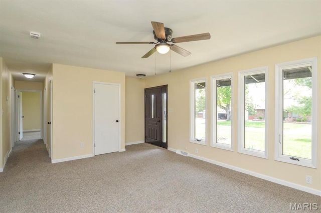 19 Ruth Ann Dr, Godfrey, IL 62035 - unfurnished room with a ceiling fan, light carpet, healthy amount of natural light, and baseboards