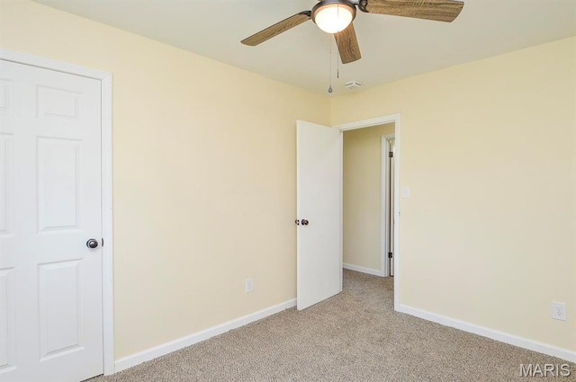 19 Ruth Ann Dr, Godfrey, IL 62035 - unfurnished bedroom featuring light colored carpet, baseboards, and a ceiling fan