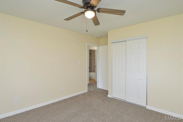 19 Ruth Ann Dr, Godfrey, IL 62035 - unfurnished bedroom featuring carpet floors, baseboards, a closet, and ceiling fan
