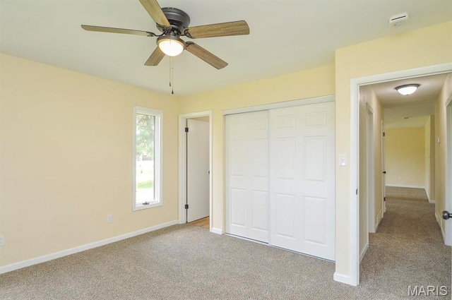 19 Ruth Ann Dr, Godfrey, IL 62035 - unfurnished bedroom with carpet flooring, baseboards, a closet, and ceiling fan