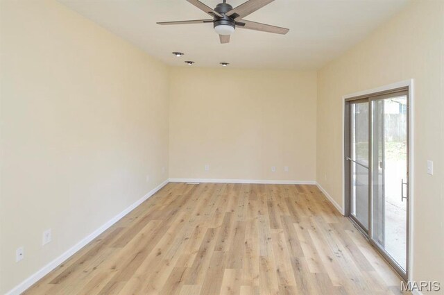 19 Ruth Ann Dr, Godfrey, IL 62035 - empty room with light wood-style floors, ceiling fan, and baseboards