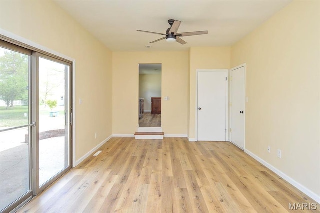 19 Ruth Ann Dr, Godfrey, IL 62035 - unfurnished room featuring a ceiling fan, light wood-style floors, and baseboards