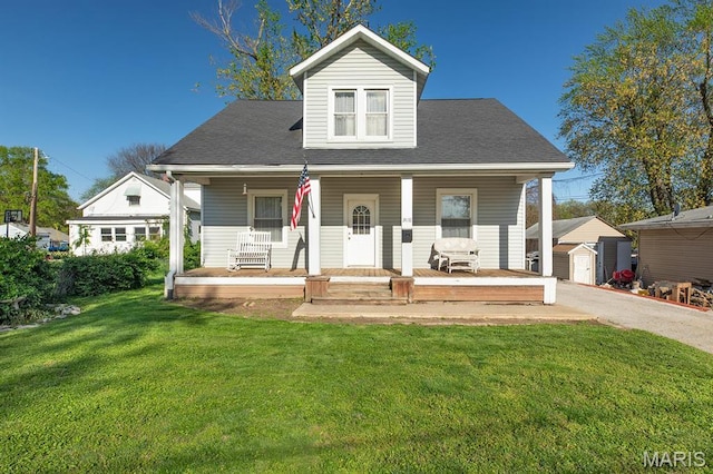 2418 Willow St, Alton, IL 62002 - bungalow-style home with an outdoor structure, a storage unit, covered porch, and a front yard