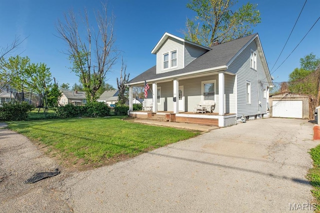2418 Willow St, Alton, IL 62002 - bungalow with covered porch, an outdoor structure, a front lawn, asphalt driveway, and a detached garage