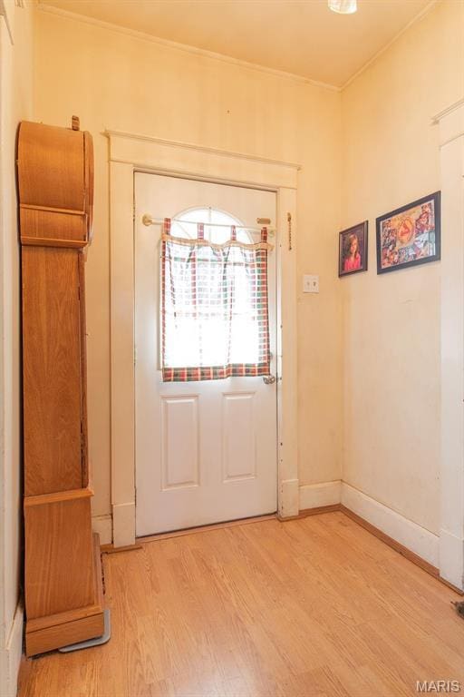 2418 Willow St, Alton, IL 62002 - doorway to outside with light wood-style floors, ornamental molding, and baseboards
