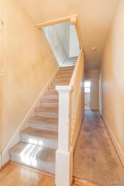 2418 Willow St, Alton, IL 62002 - stairway featuring baseboards