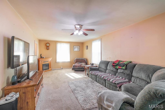 2418 Willow St, Alton, IL 62002 - carpeted living room featuring a ceiling fan and baseboards