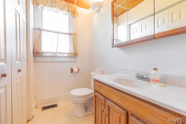 2418 Willow St, Alton, IL 62002 - bathroom with toilet, vanity, and baseboards