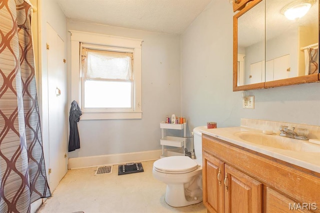 2418 Willow St, Alton, IL 62002 - bathroom featuring vanity, toilet, baseboards, and a shower with shower curtain