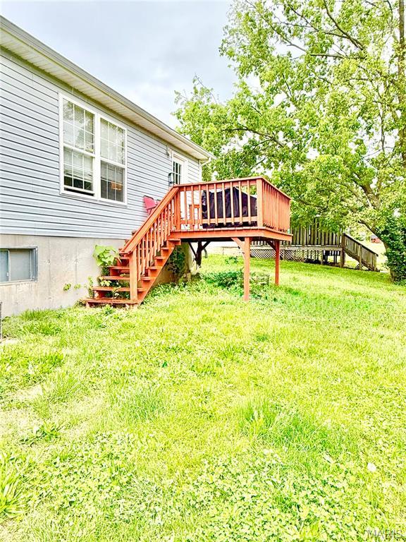 305 Houser St, Park Hills, MO 63601 - view of grassy yard featuring stairs and a deck