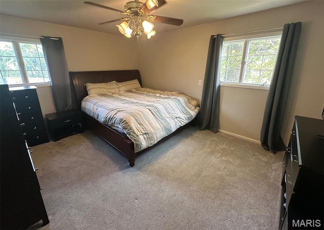 1621 Shurtleff Ct, Alton, IL 62002 - bedroom featuring multiple windows, light carpet, a ceiling fan, and baseboards