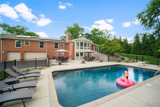12935 Topping Estates Dr, Town And Country, MO 63131 - view of pool featuring outdoor dining space, a patio area, a fenced backyard, and a diving board