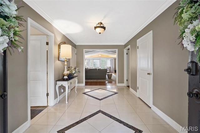 12935 Topping Estates Dr, Town And Country, MO 63131 - entryway featuring light tile patterned flooring, crown molding, baseboards, and inlaid floor details