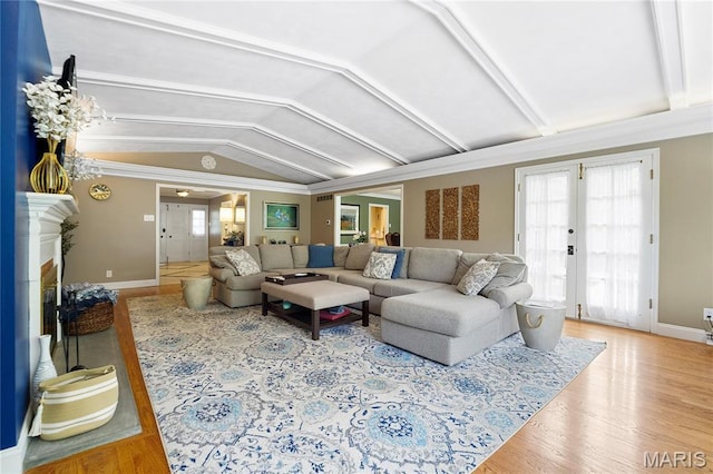 12935 Topping Estates Dr, Town And Country, MO 63131 - living room with vaulted ceiling, wood finished floors, plenty of natural light, and baseboards