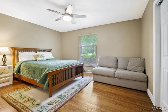 12935 Topping Estates Dr, Town And Country, MO 63131 - bedroom featuring wood finished floors, ceiling fan, and baseboards