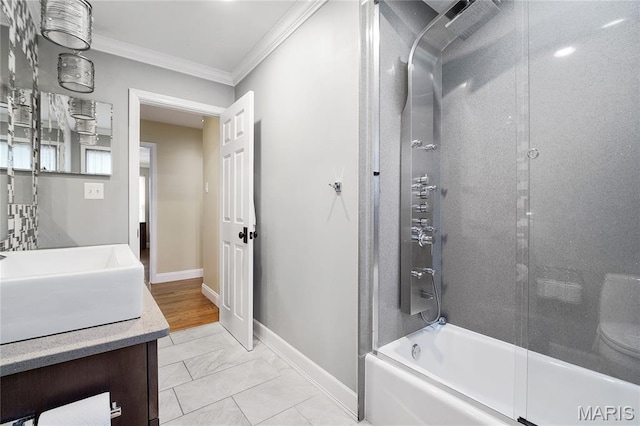 12935 Topping Estates Dr, Town And Country, MO 63131 - bathroom with crown molding, baseboards, marble look tiles, vanity, and bathtub / shower combination