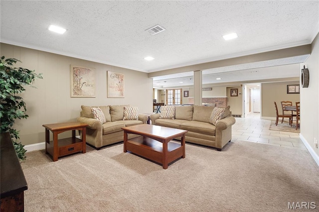 12935 Topping Estates Dr, Town And Country, MO 63131 - living area featuring a textured ceiling, ornamental molding, baseboards, recessed lighting, and light colored carpet