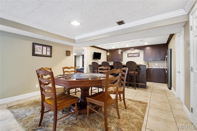 12935 Topping Estates Dr, Town And Country, MO 63131 - dining room with ornamental molding, light tile patterned flooring, baseboards, and a textured ceiling
