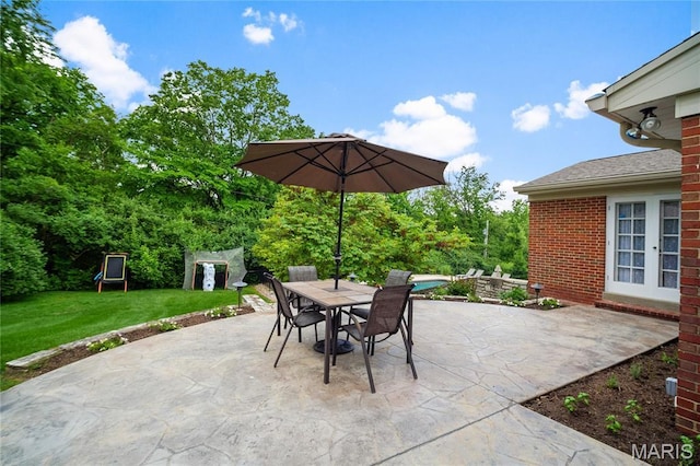 12935 Topping Estates Dr, Town And Country, MO 63131 - view of patio / terrace with outdoor dining space and a swimming pool