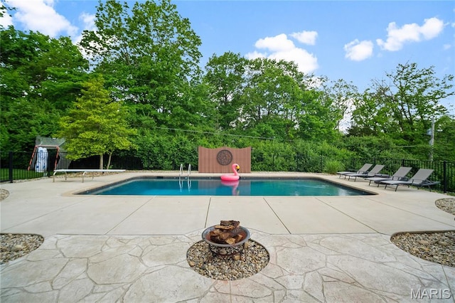 12935 Topping Estates Dr, Town And Country, MO 63131 - view of swimming pool with a fire pit, a patio area, and a fenced backyard