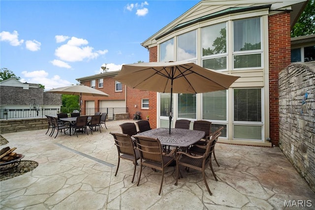 12935 Topping Estates Dr, Town And Country, MO 63131 - view of patio featuring outdoor dining area and fence
