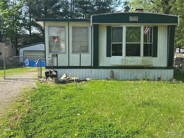 215 Meddows Ln, Ofallon, IL 62269 - view of property exterior with dirt driveway and a detached garage