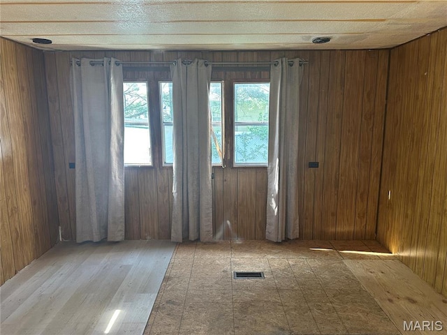 215 Meddows Ln, Ofallon, IL 62269 - spare room featuring wooden walls