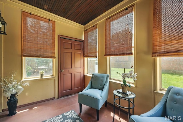7350 Colgate Ave, University City, MO 63130 - sitting room featuring plenty of natural light, baseboards, wood finished floors, and wood ceiling