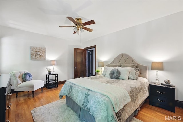 7350 Colgate Ave, University City, MO 63130 - bedroom with light wood-style floors, baseboards, and ceiling fan