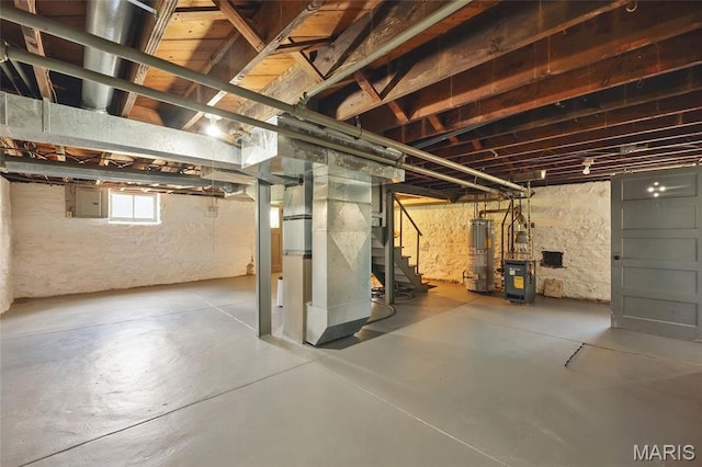 7350 Colgate Ave, University City, MO 63130 - below grade area with gas water heater, heating unit, stairs, electric panel, and a heating unit