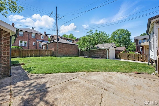 7350 Colgate Ave, University City, MO 63130 - view of yard with a patio area, a residential view, and a detached garage