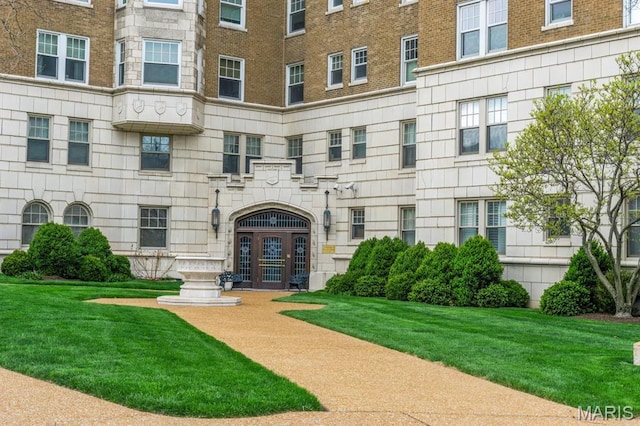 entrance to property with brick siding and french doors