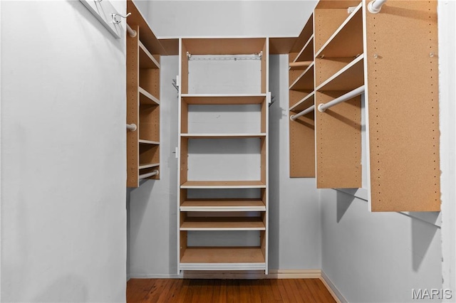 spacious closet with wood finished floors
