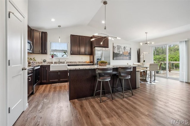 1007 Crows Nest Ct, Caseyville, IL 62232 - kitchen with appliances with stainless steel finishes, a chandelier, lofted ceiling, a center island, and dark brown cabinetry