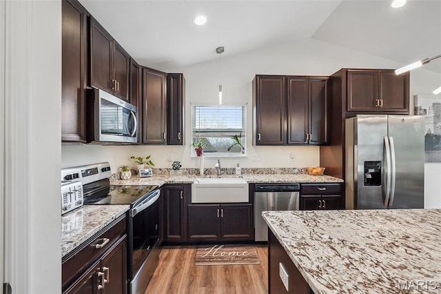 1007 Crows Nest Ct, Caseyville, IL 62232 - kitchen with stainless steel appliances, a sink, lofted ceiling, light wood finished floors, and dark brown cabinetry