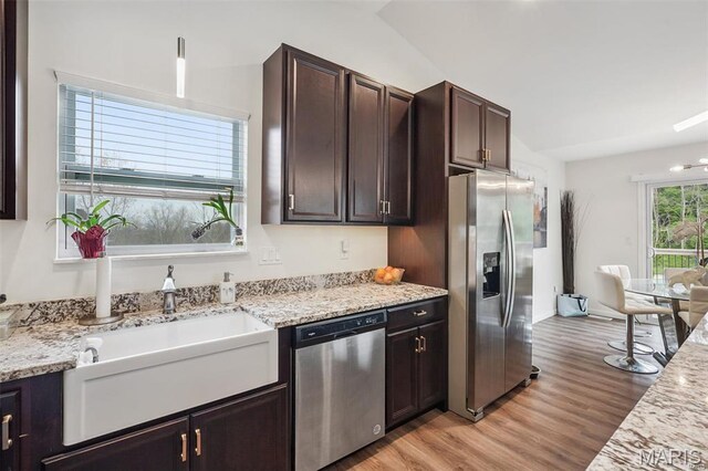 1007 Crows Nest Ct, Caseyville, IL 62232 - kitchen with appliances with stainless steel finishes, light wood-style flooring, a sink, dark brown cabinets, and light stone countertops