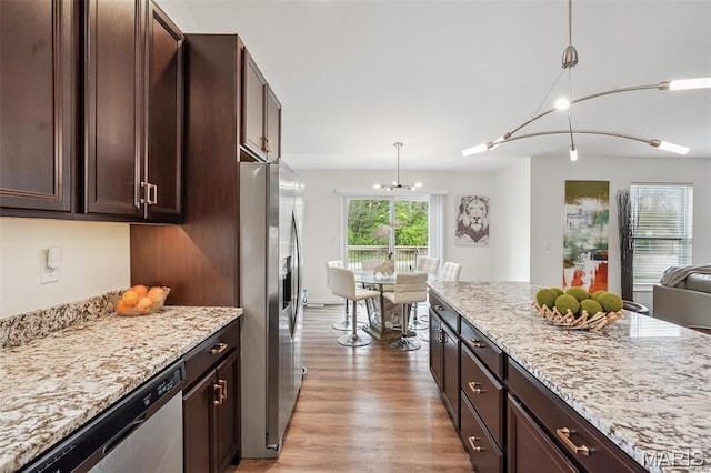 1007 Crows Nest Ct, Caseyville, IL 62232 - kitchen with appliances with stainless steel finishes, a chandelier, open floor plan, pendant lighting, and dark brown cabinets