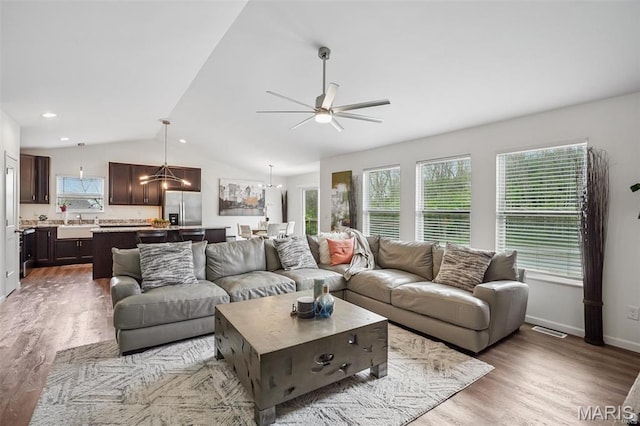 1007 Crows Nest Ct, Caseyville, IL 62232 - living room featuring lofted ceiling, light wood finished floors, a ceiling fan, and baseboards