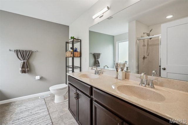 1007 Crows Nest Ct, Caseyville, IL 62232 - bathroom with a stall shower, double vanity, baseboards, and toilet