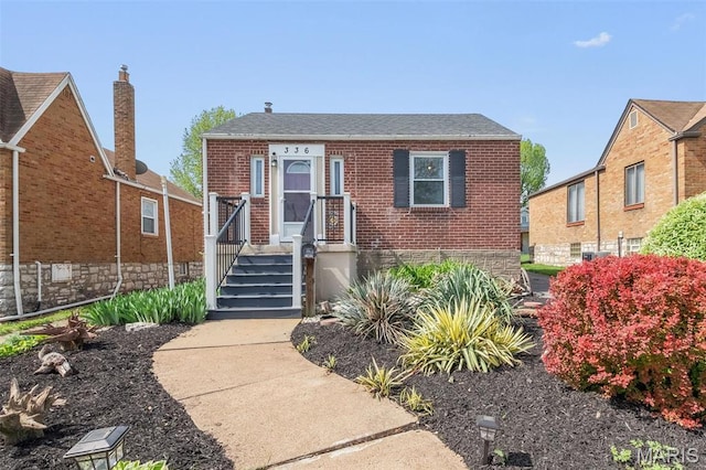 336 Tacoma Dr, Saint Louis, MO 63125 - view of front of home featuring brick siding and a shingled roof